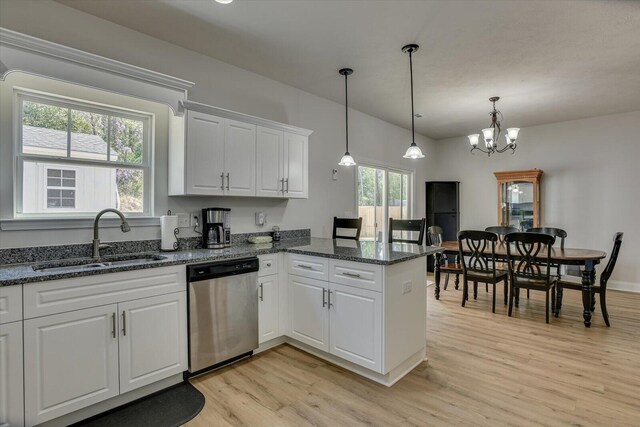 kitchen featuring white cabinetry, sink, light hardwood / wood-style flooring, stainless steel dishwasher, and pendant lighting