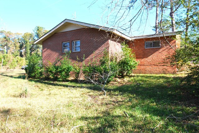 view of home's exterior featuring a lawn