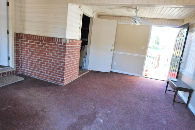 interior space with ceiling fan and carpet floors