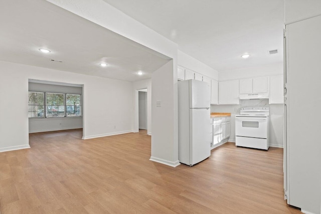 kitchen featuring white appliances, white cabinetry, and light hardwood / wood-style floors