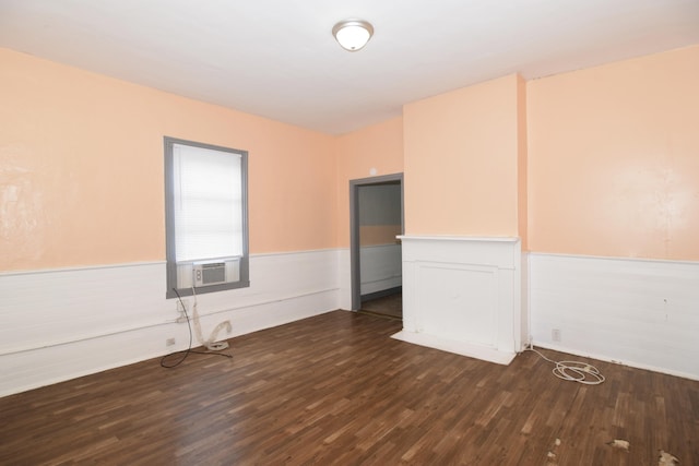 spare room with dark hardwood / wood-style flooring and cooling unit