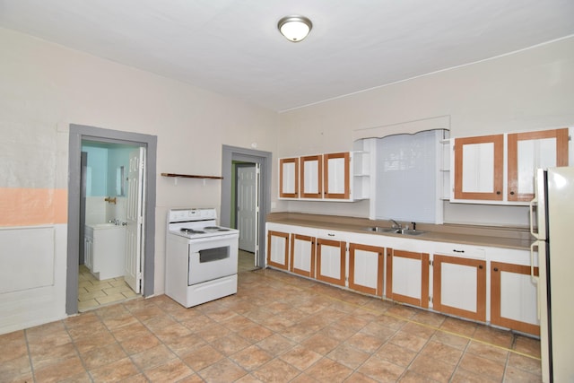 kitchen featuring white appliances and sink