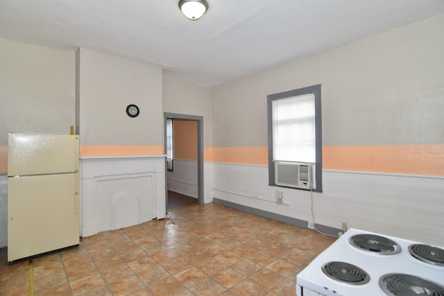 kitchen featuring white cabinets and white appliances