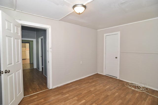 spare room with hardwood / wood-style floors