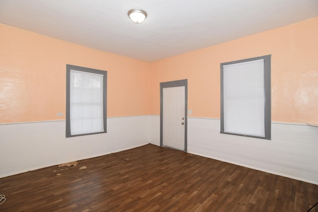 spare room with hardwood / wood-style floors