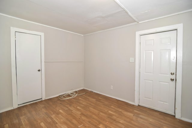 unfurnished room featuring wood-type flooring