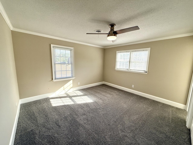 spare room featuring baseboards, a wealth of natural light, and crown molding
