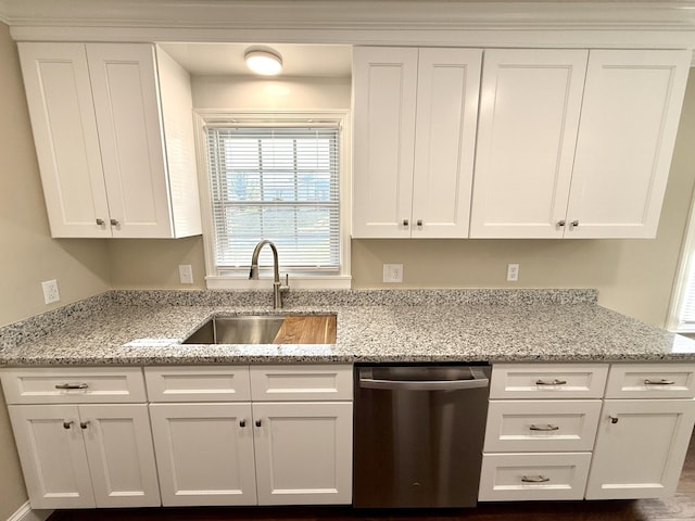 kitchen featuring white cabinetry, light stone countertops, a sink, and dishwasher