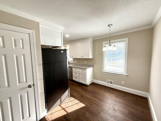 kitchen with a textured ceiling, visible vents, dark wood finished floors, white cabinets, and appliances with stainless steel finishes