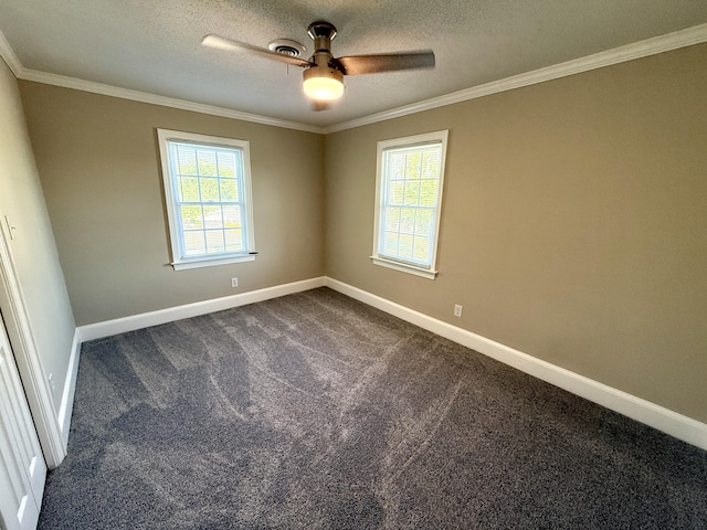 spare room with crown molding, baseboards, and ceiling fan