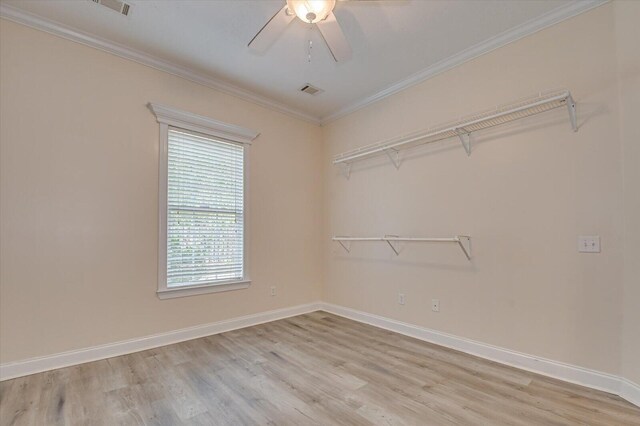 interior space featuring crown molding, ceiling fan, and light wood-type flooring