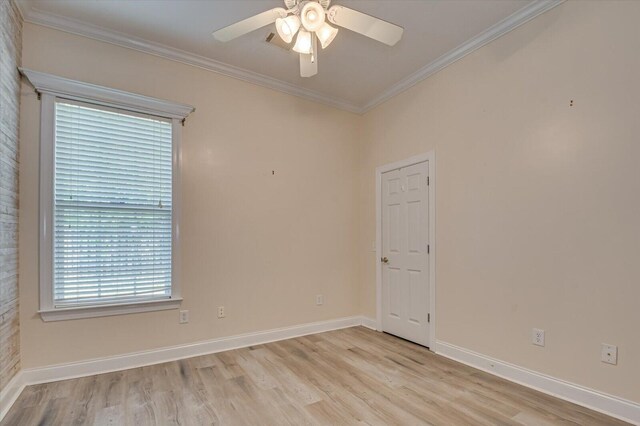 empty room with ceiling fan, crown molding, and light wood-type flooring