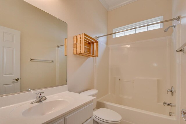 full bathroom featuring vanity, toilet, ornamental molding, and tub / shower combination