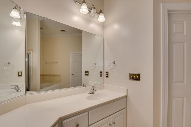 bathroom with plus walk in shower, vanity, and crown molding