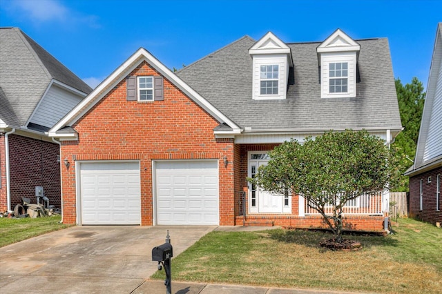 view of front of home featuring a front yard and a garage