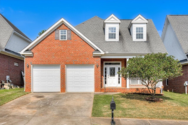 view of front of house with a front lawn and a garage