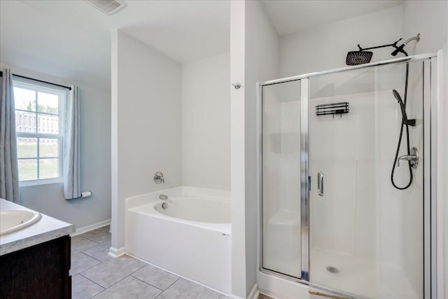 full bathroom featuring tile patterned flooring, a bath, visible vents, and a shower stall