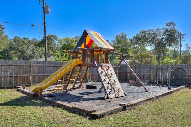 view of jungle gym with a lawn