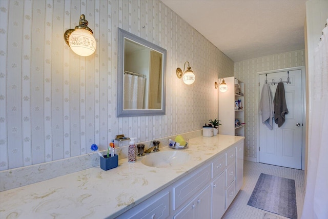 bathroom with tile patterned floors and vanity