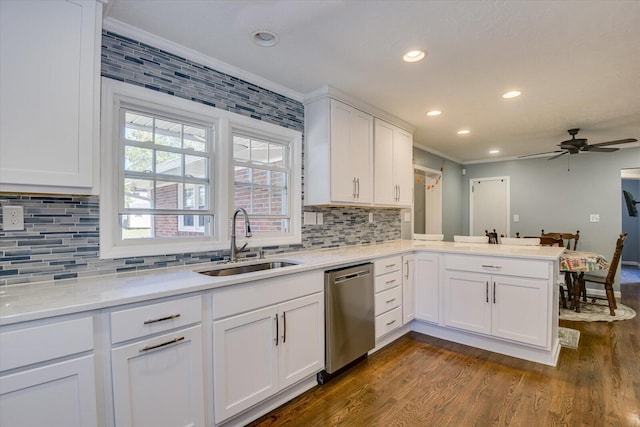 kitchen featuring kitchen peninsula, ceiling fan, sink, dishwasher, and white cabinetry