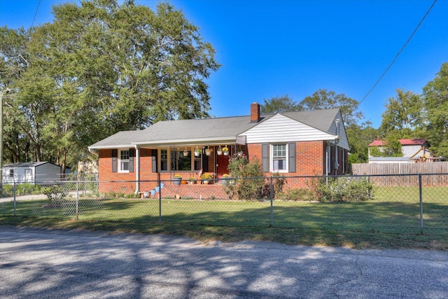 view of front of house with a porch and a front yard