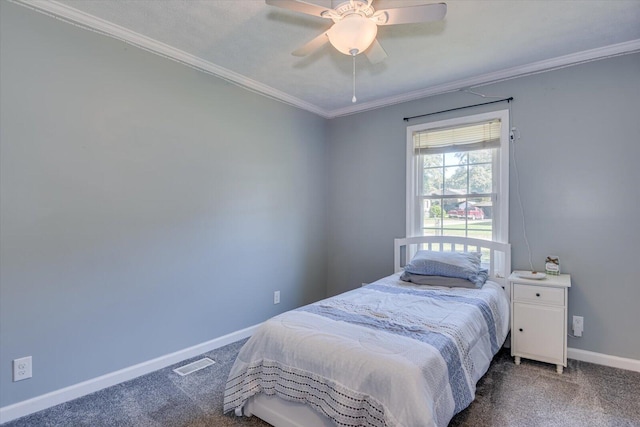 carpeted bedroom with ceiling fan and crown molding