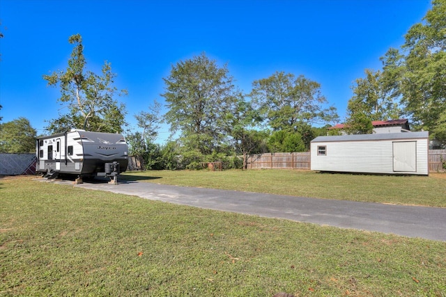 view of yard with a storage shed