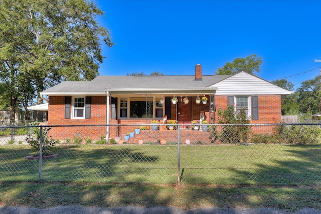 ranch-style house featuring a front lawn