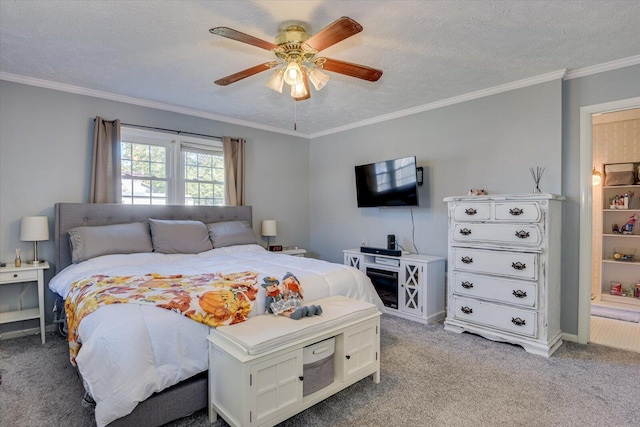 carpeted bedroom with ceiling fan, crown molding, and a textured ceiling