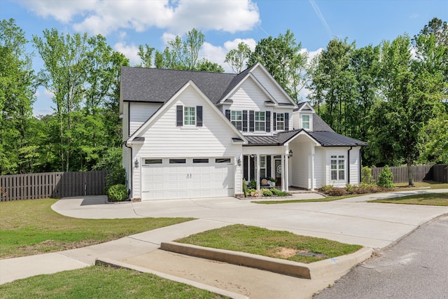3108 Wildflower Ct, Evans, GA 30809 - traditional home with concrete driveway, a garage, a standing seam roof, metal roof, and a shingled roof