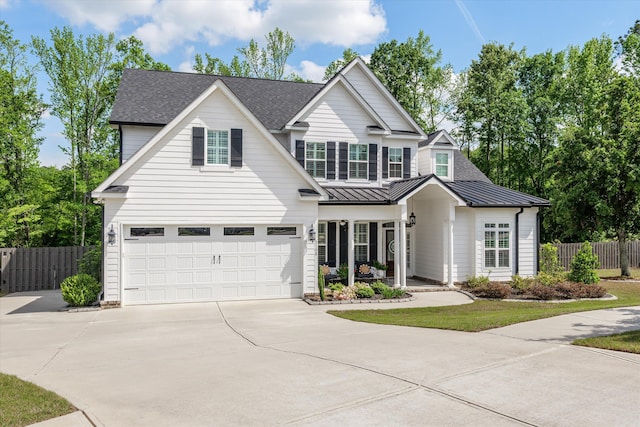 3108 Wildflower Ct, Evans, GA 30809 - traditional home with driveway, a standing seam roof, a garage, roof with shingles, and metal roof