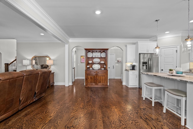 3108 Wildflower Ct, Evans, GA 30809 - living area featuring arched walkways, recessed lighting, crown molding, dark wood-style flooring, and baseboards