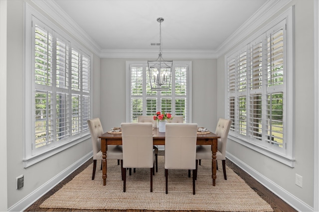 3108 Wildflower Ct, Evans, GA 30809 - dining room with healthy amount of natural light, baseboards, a chandelier, and ornamental molding