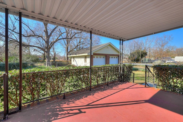 view of patio with an outdoor structure and fence