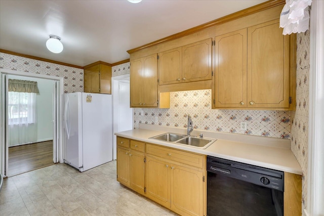 kitchen with light countertops, freestanding refrigerator, a sink, dishwasher, and wallpapered walls