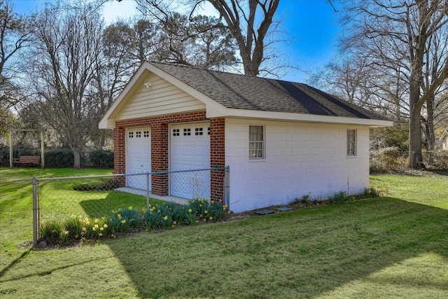 detached garage featuring fence