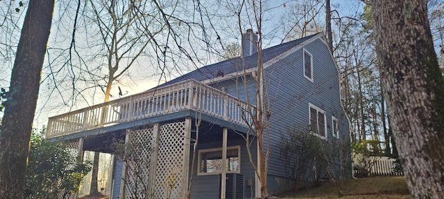 view of side of home with a chimney