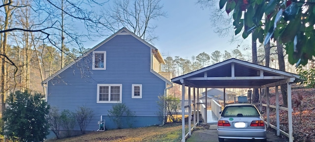 exterior space with a carport