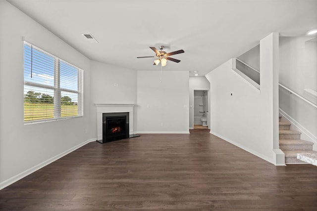 1255 Birch Cir, Grovetown, GA 30813 - unfurnished living room featuring a ceiling fan, stairway, a warm lit fireplace, and dark wood-style flooring