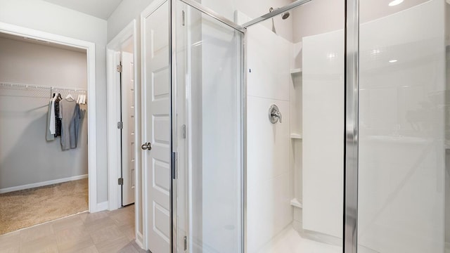 1255 Birch Cir, Grovetown, GA 30813 - bathroom featuring a stall shower, a spacious closet, and baseboards