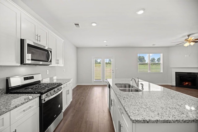 1255 Birch Cir, Grovetown, GA 30813 - kitchen with stainless steel appliances, a sink, a kitchen island with sink, dark wood-style floors, and recessed lighting