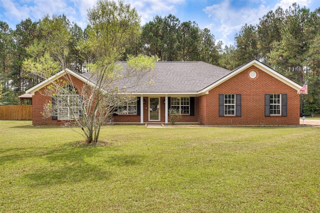 ranch-style home with a front lawn