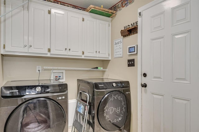 laundry area featuring cabinets and washer and dryer