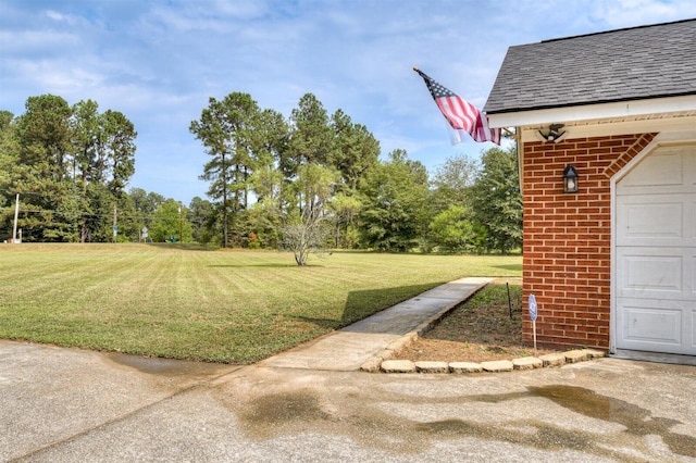 view of yard featuring a garage