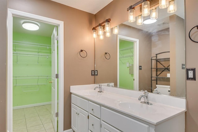 bathroom with vanity and tile patterned floors