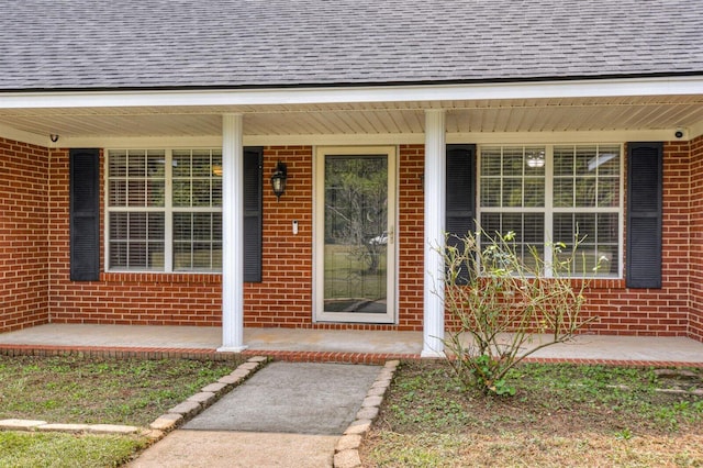 doorway to property with a porch