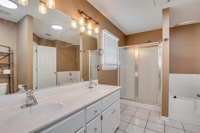 bathroom featuring vanity, tile patterned flooring, and plus walk in shower