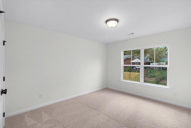 unfurnished room featuring carpet flooring