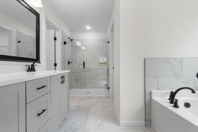 bathroom with vanity and independent shower and bath