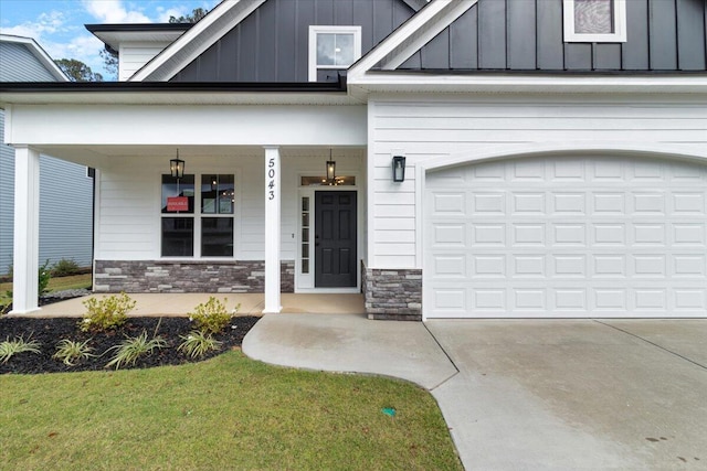 doorway to property featuring covered porch